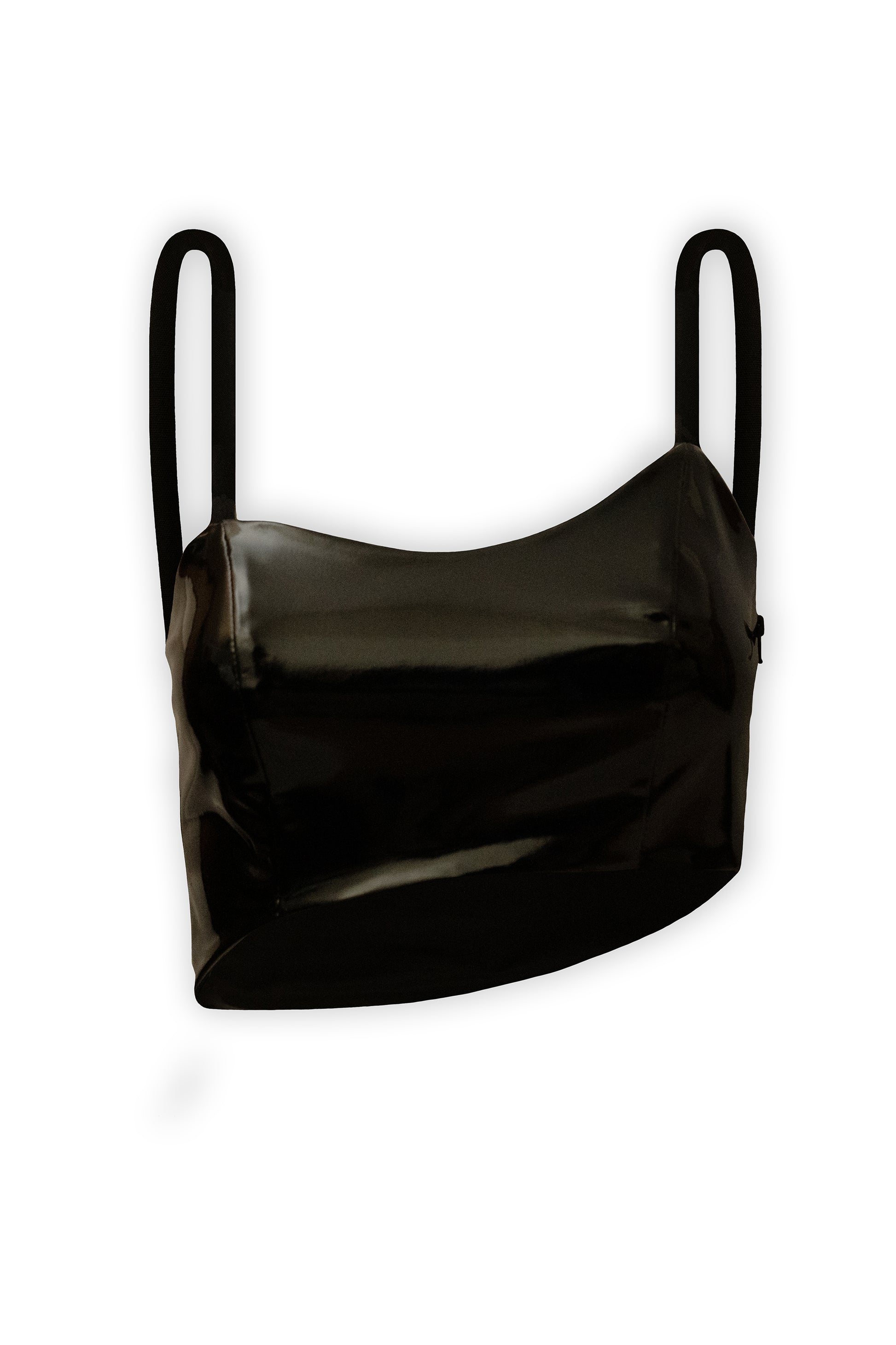The photograph presents a black asymmetric crop top with rope straps. It is made from 100% eco leather, closed with soft lining. The asymmetric crop top photograph is from the front on a white background.